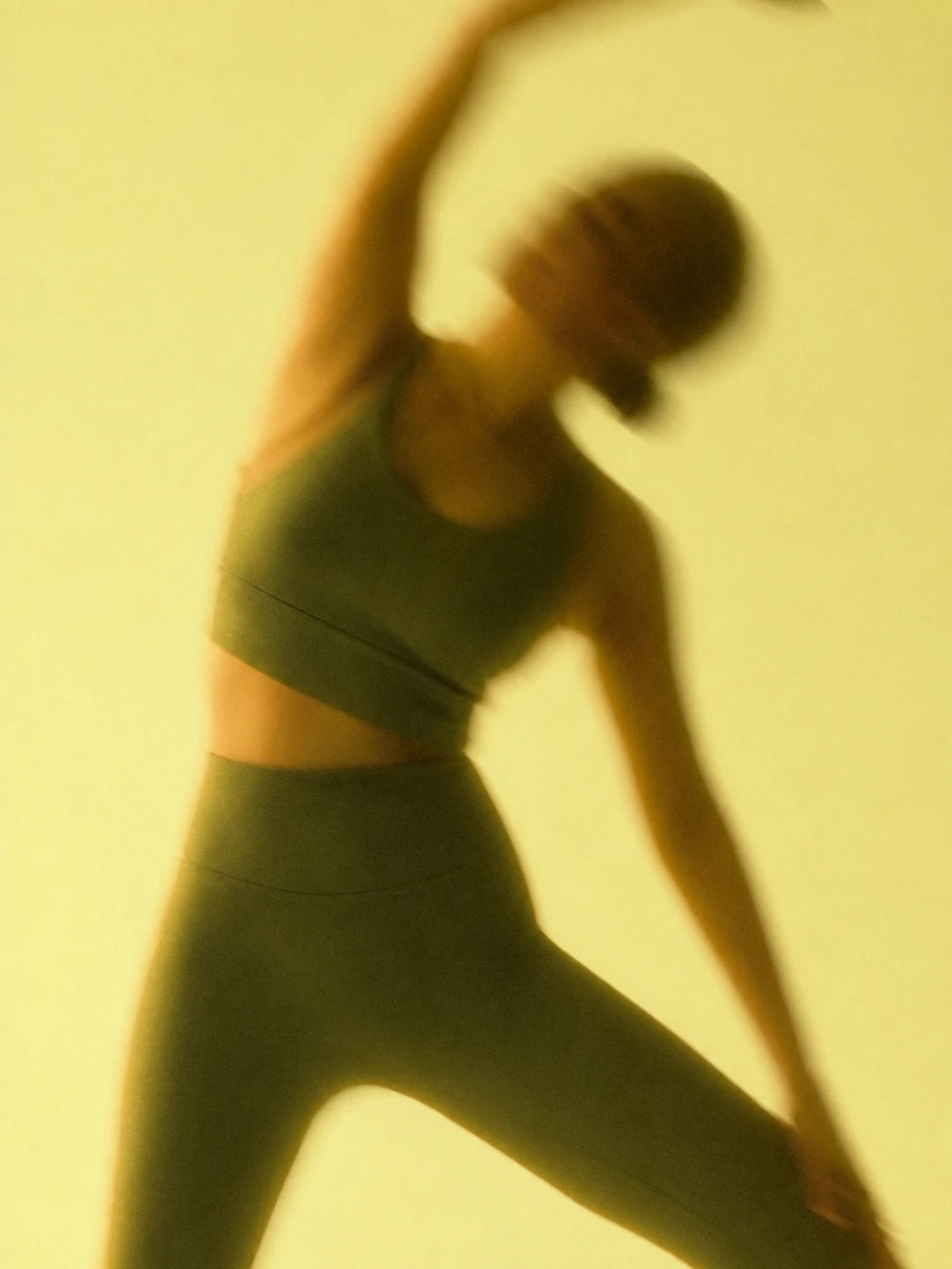 A woman stretching in motion blur